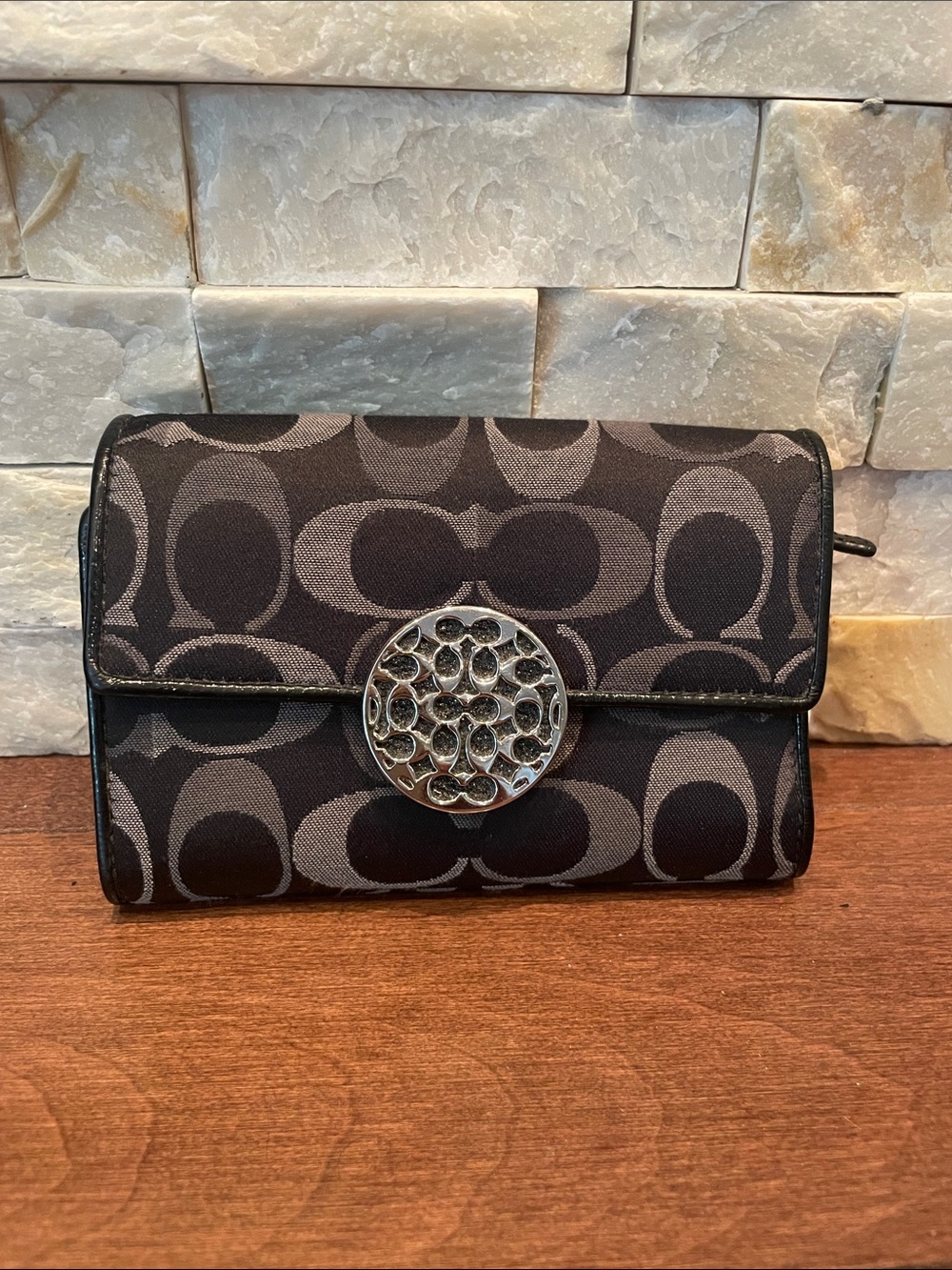 Coach Black Signature Canvas Wallet with Decorative Silver Medallion